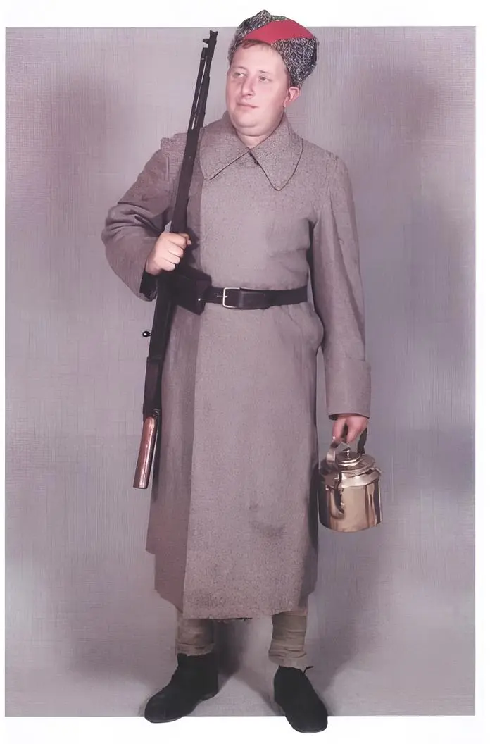 Red Army soldier 1918 in early Russian Civil War uniform with winter coat and papakha hat