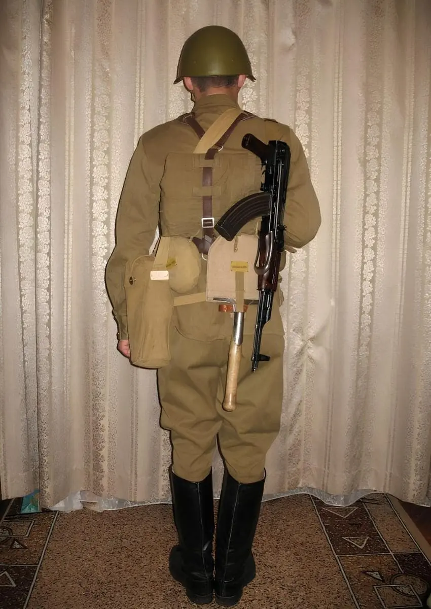 Soviet red army soldier with jacket and helmet for reenacting