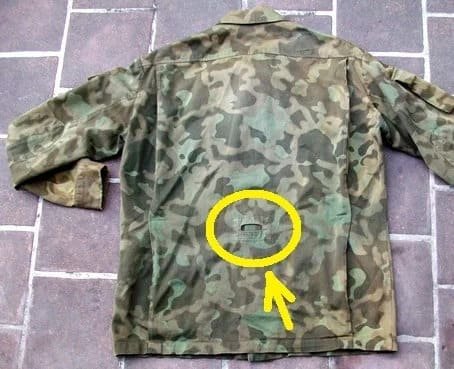 Highlighted suspender attachment hole on back of Soviet Butan jacket