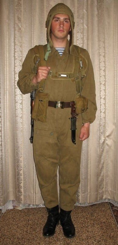 Soviet paratrooper wearing RD-54 airborne backpack lowered position, preparing for parachute jump