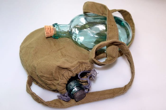 Soviet Red Army glass canteen with fabric cover and shoulder strap, World War II