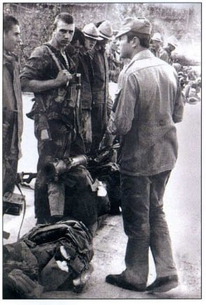 Soviet Spetsnaz soldiers during the Afghan War standing with field equipment and weapons, historical black and white photograph