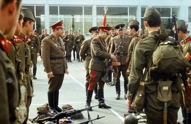 Cold War Soviet motor rifle troops in service uniform during equipment inspection