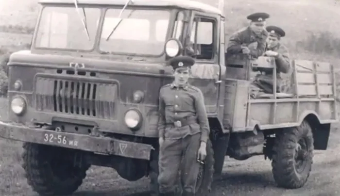 GAZ-66 Soviet Army truck with Cold War era soldier in service uniform