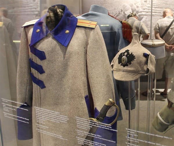 Imperial Russian army parade uniform and early Budyonovka hat, museum display