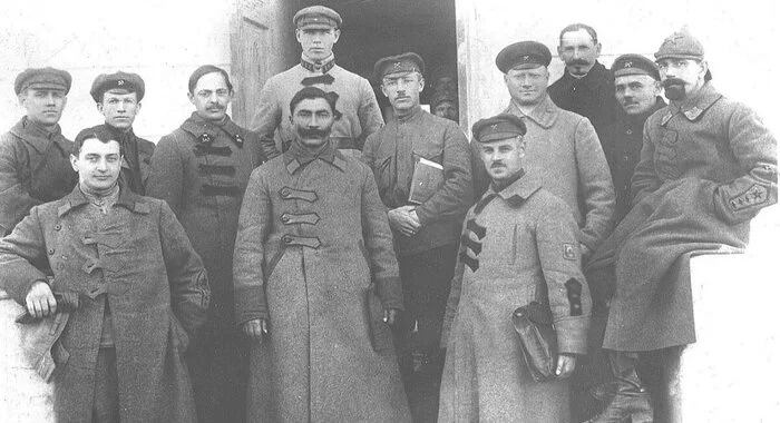 Red Army commanders during the Russian Civil War, 1920, wearing early Soviet military uniforms and greatcoats