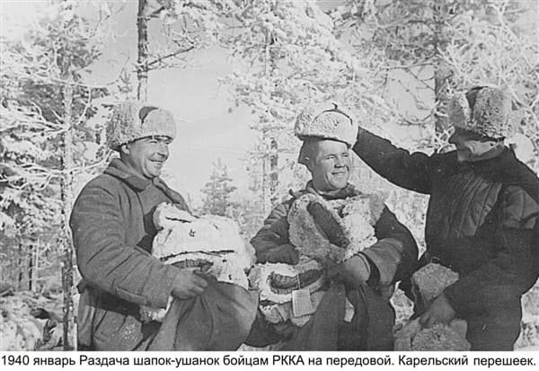 Red Army soldiers receiving ushanka hats on the frontline during the Winter War, January 1940