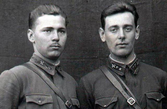 RKKA soldiers wearing Red Army uniforms of the 1930s and early 1940s, showing collar tabs, gymnastyorka shirts, leather belts, and pre-WW2 Soviet military insignia