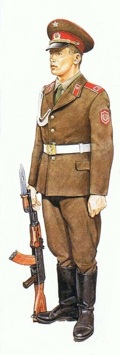 Soviet Army soldier wearing parade dress uniform with ceremonial belt and AK rifle