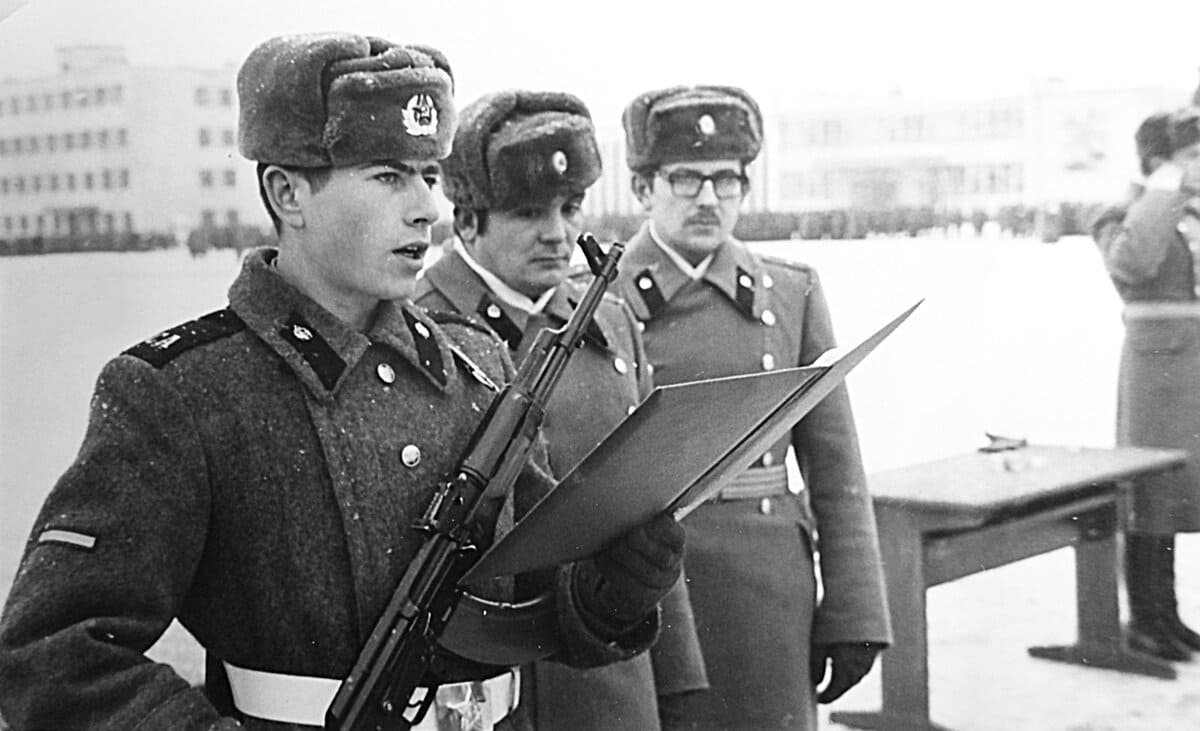 Soviet soldier wearing white parade belt during oath ceremony, 1980 USSR