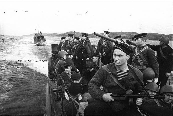Soviet sailors wearing telnyashka striped shirts during wartime operation, symbol of russian navy heroism