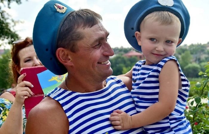 Father and child wearing blue striped VDV telnyashka shirts and airborne berets