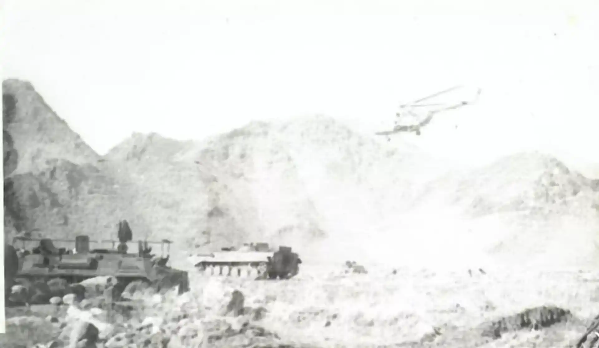 Soviet VDV convoy and military helicopter during the Afghan War