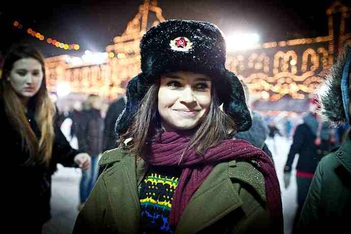 Russian woman wearing a Soviet ushanka with a red star in winter
