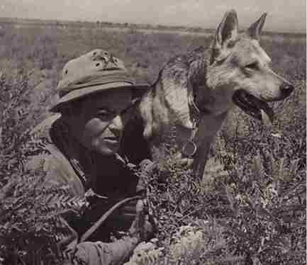 Soviet soldier wearing a military Panama hat with a dog